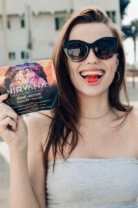 Nirvana CBD Gummies Review | A woman eating Nirvana CBD gummies